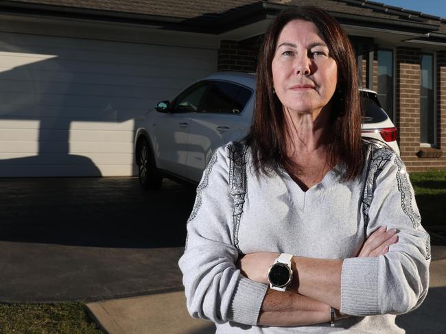 Anne Chapman pictured outside her investment property in Spring Farm. Picture: Damian Shaw