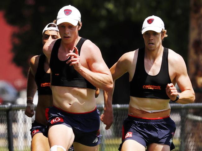 Christian Salem, Mitch Hannan and Pat McKenna doing sprint work at Melbourne training. Picture: Michael Klein.