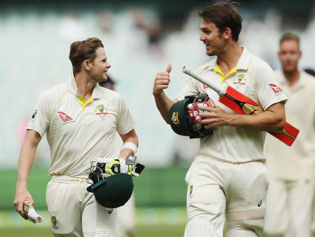 Steve Smith (L) and Mitchell Marsh walk off the MCG.