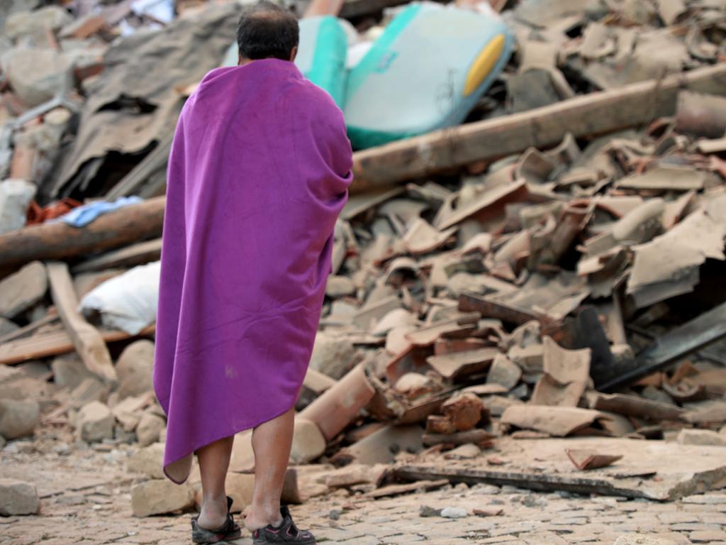 A man stands among the rubble of a house after a strong earthquake hit Amatrice on August 24, 2016. Picture: AFP