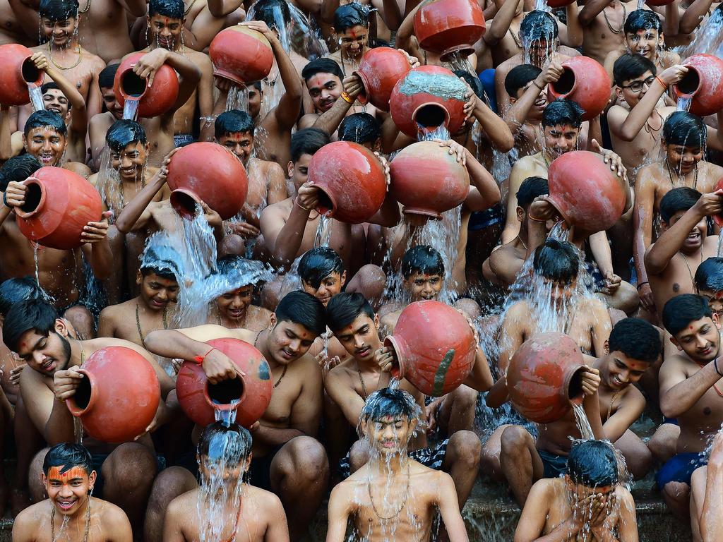 Students in Ahmedabad partake in a traditional ‘Magh Snan’, embracing spiritual cleansing through a sacred bath. Picture: Sam Panthanky/AFP