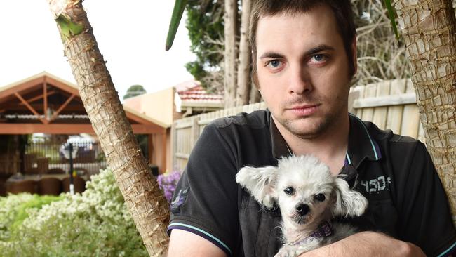 Daniel Morphett with dog Chloe — his other dog was killed by a fox in his Wantirna backyard last year. Picture: Steve Tanner