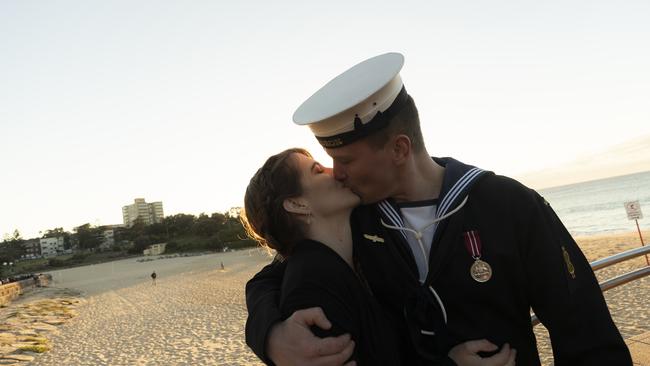 Montana Seaman with her partner and serviceman Luke Williams share a moment after the Dawn Service at Coogee Beach in Sydney this morning. Picture: Getty