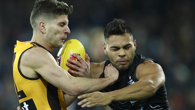 Jarman Impey pushes Hawthorn’s Luke Breust aside. Picture: Sarah Reed.