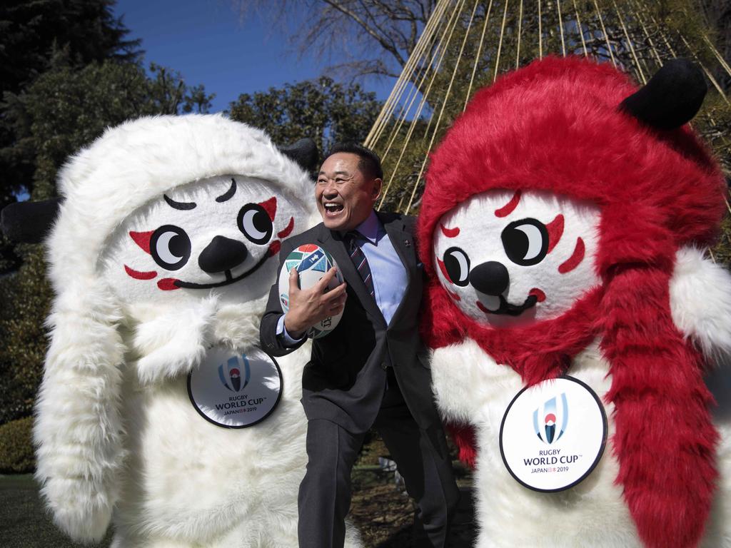 Former Japanese football player Yasutaro Matsuki poses with mascots Ren (L) and G (R) during a photo session to unveil the official mascots of the Rugby World Cup 2019. Picture: AFP