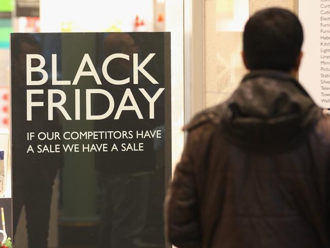 MANCHESTER, UNITED KINGDOM - NOVEMBER 27: Shoppers wait for the the John Lewis store to open at 8am, inside The Trafford Centre, with the hope of a 'Black Friday' bargain on November 27, 2015 in Manchester, United Kingdom. Retailers have seen a slow start of shoopers arriving at stores for the 'Black Friday' sales with many shoppers pruchasing bargains online. Analysts are predicting record online sales of discounted goods. Many stores are also distributing discounted goods across the weekend to avoid the hectic scenes of bargain hunters in previous years. (Photo by Christopher Furlong/Getty Images)