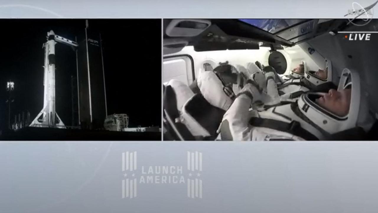ESA (European Space Agency) astronaut Thomas Pesquet, NASA astronauts Megan McArthur and Shane Kimbrough, and Japan Aerospace Exploration Agency (JAXA) astronaut Akihiko Hoshide inside the capsule. Picture: NASA TV / AFP
