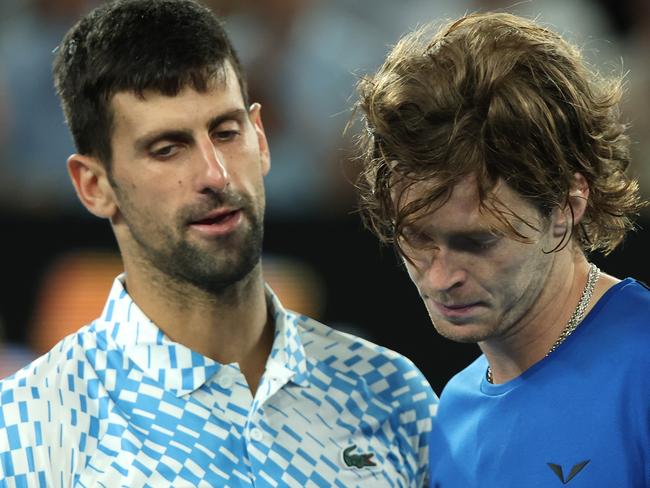 MELBOURNE, AUSTRALIA - JANUARY 25: Novak Djokovic of Serbia and Andrey Rublev and embrace at the net in the Quarterfinal singles match between Andrey Rublev and Novak Djokovic of Serbia during day ten of the 2023 Australian Open at Melbourne Park on January 25, 2023 in Melbourne, Australia. (Photo by Mark Kolbe/Getty Images)