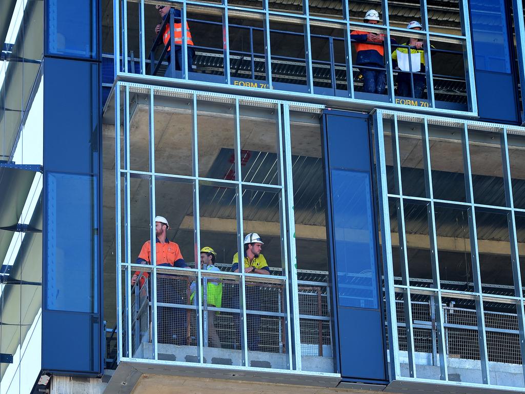 Construction works at the new State Government building at Port Adelaide stop to watch the start. Picture: Bianca De Marchi