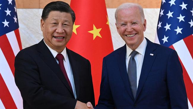 Xi Jinping and Joe Biden shake hands as they meet on the sidelines of the G20 Summit in Bali in 2022. Picture: AFP