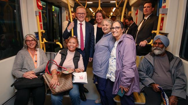 The Prime Minister, Anthony Albanese, rides light rail with the ALP candidate for the seat of Fadden, Letitia Del Fabbro on the Gold Coast. Picture: Glenn Campbell / NCA Newswire