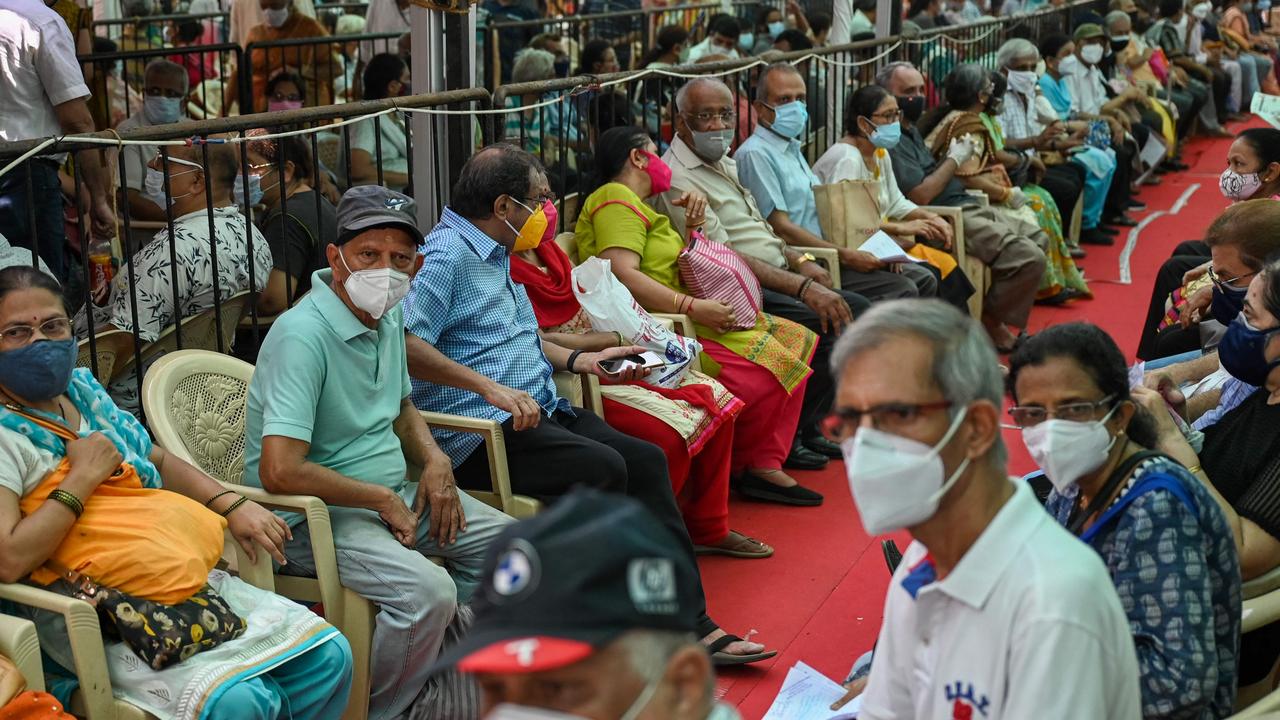 People queue up to receive a dose of a coronavirus vaccine in Mumbai on April 27. Picture: Punit Paranjpe/AFP