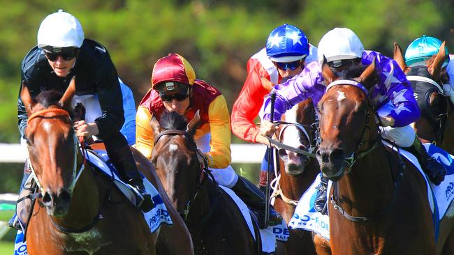 Jamie McDonald on Leebaz , left, at the home turn, was the eventual winner of race 5 at Warwick Farm races. pic mark evans