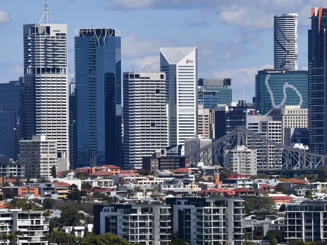 Houses and apartment buildings are seen against the Brisbane CBD skyline in Brisbane, Monday, August 27, 2018. According to property data company CoreLogic, Brisbane's median house price has risen 1.3 per cent over the past year, and is currently sitting at $538,693. (AAP Image/Darren England) NO ARCHIVING