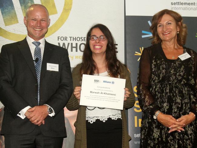 Bankstown Senior College student, Marwah Al-Khameesi, centre, with Richard Feledy, Managing Director, Allianz Australia, and Violet Roumeliotis, CEO of Settlement Services International, after receiving her SSI scholarship in April.