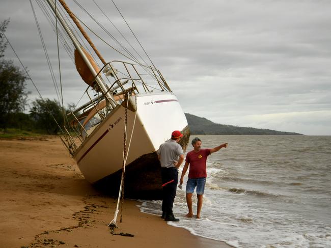 Cyclone Kirrily Townsville 2024. Owner of Skylark Peter Bright talks to a passerby at Pallarenda. Picture: Evan Morgan
