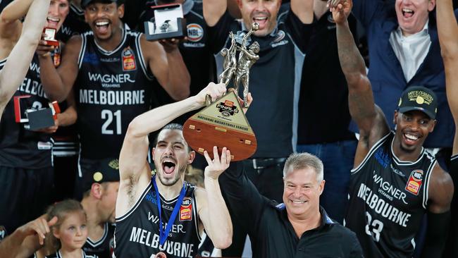 Melbourne United players and coaches celebrate the NBL Grand Final win. Picture: Getty