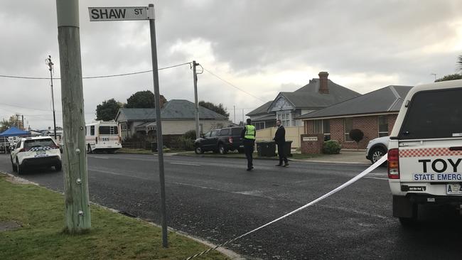 Tasmania Police crime scene investigators and officers on Main Street in Ulverstone where a woman was found dead. Photo: Helen Kempton