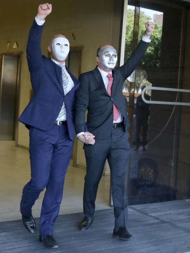 Victims, brothers known publicly only as "A" and "B" for legal reasons, leave the District Court following the sentencing of child sex offender Vivian Frederick Deboo on Tuesday. Picture Dean Martin