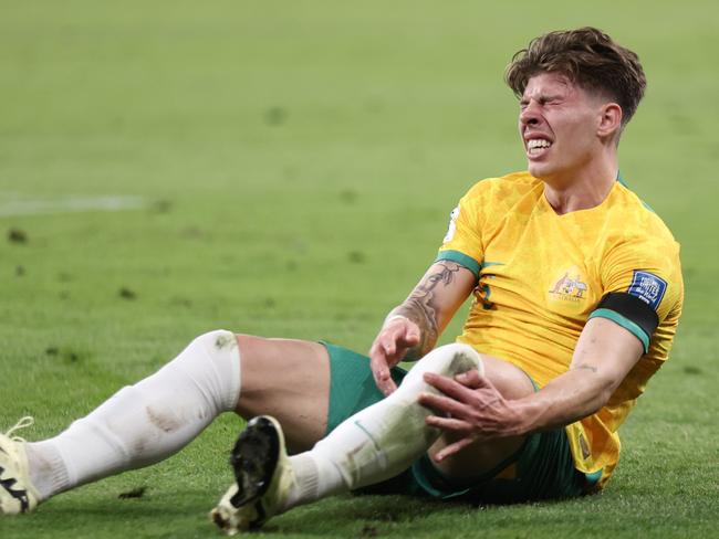 SYDNEY, AUSTRALIA - MARCH 21: Jordan Bos of Australia holds his leg in pain during the FIFA World Cup 2026 Qualifier match between Australia Socceroos and Lebanon at CommBank Stadium on March 21, 2024 in Sydney, Australia. (Photo by Matt King/Getty Images)