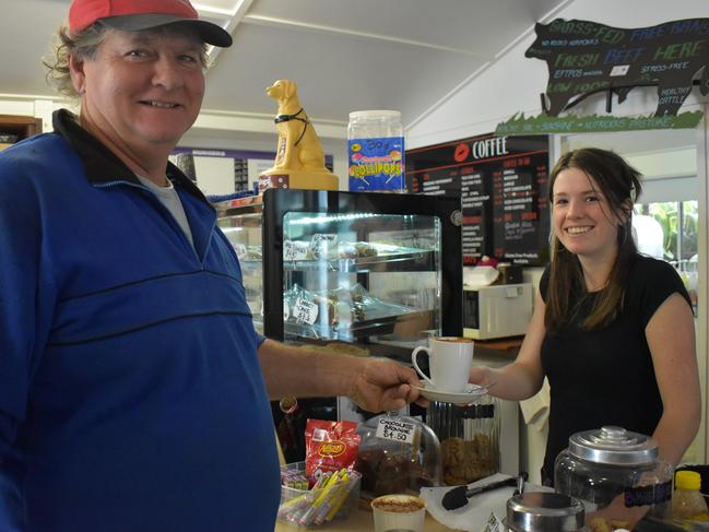 Eungella resident Dale Fortescue buying his last cup of coffee prepared by staff member Indiana Sheehy. Picture: Heidi Petith