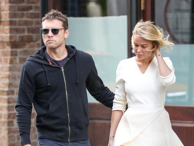 Lara Bingle and Sam Worthington arrive at a medical clinic in New York in September, 2014.