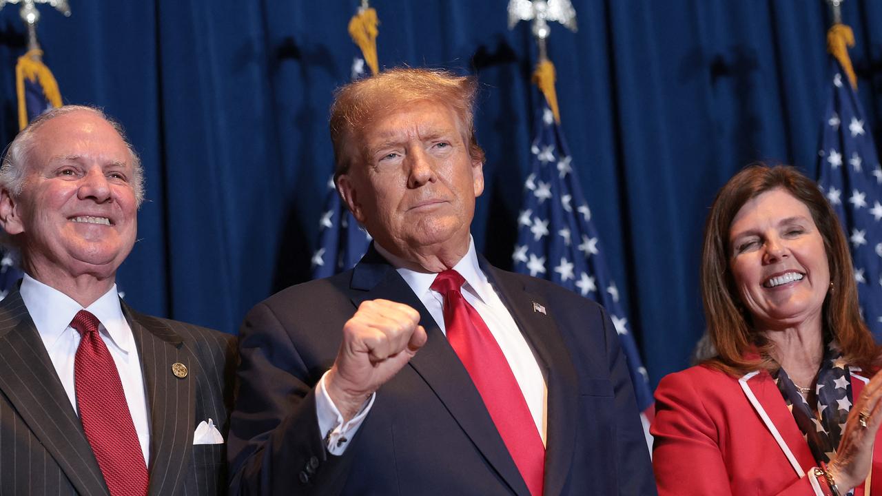 South Carolina Governor Henry McMaster, Republican presidential candidate Donald Trump and Lt Governor during an election night watch party at the State Fairgrounds on February 24, 2024 in Columbia, South Carolina. (Photo by WIN MCNAMEE / GETTY IMAGES NORTH AMERICA / Getty Images via AFP)