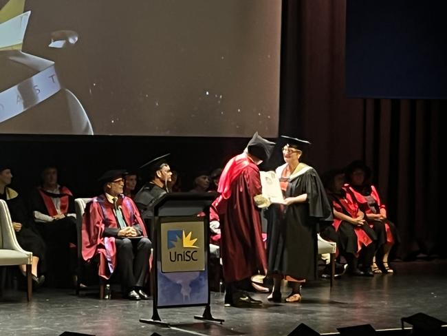 Graduates from the University of the Sunshine Coast's Fraser Coast campus celebrating at the Brolga Theatre.