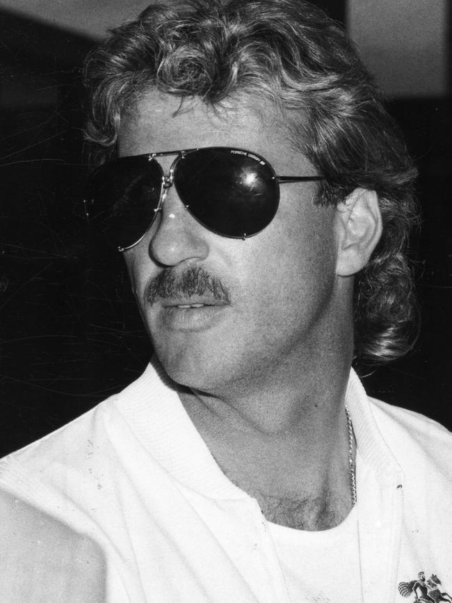 Ian Botham arrives at Adelaide Airport for the third Ashes Test in 1986. Photo: Bryan Charlton.