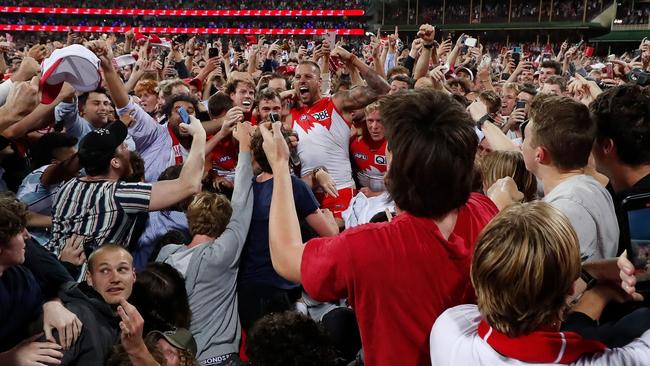 Lance Franklin celebrates with fans.