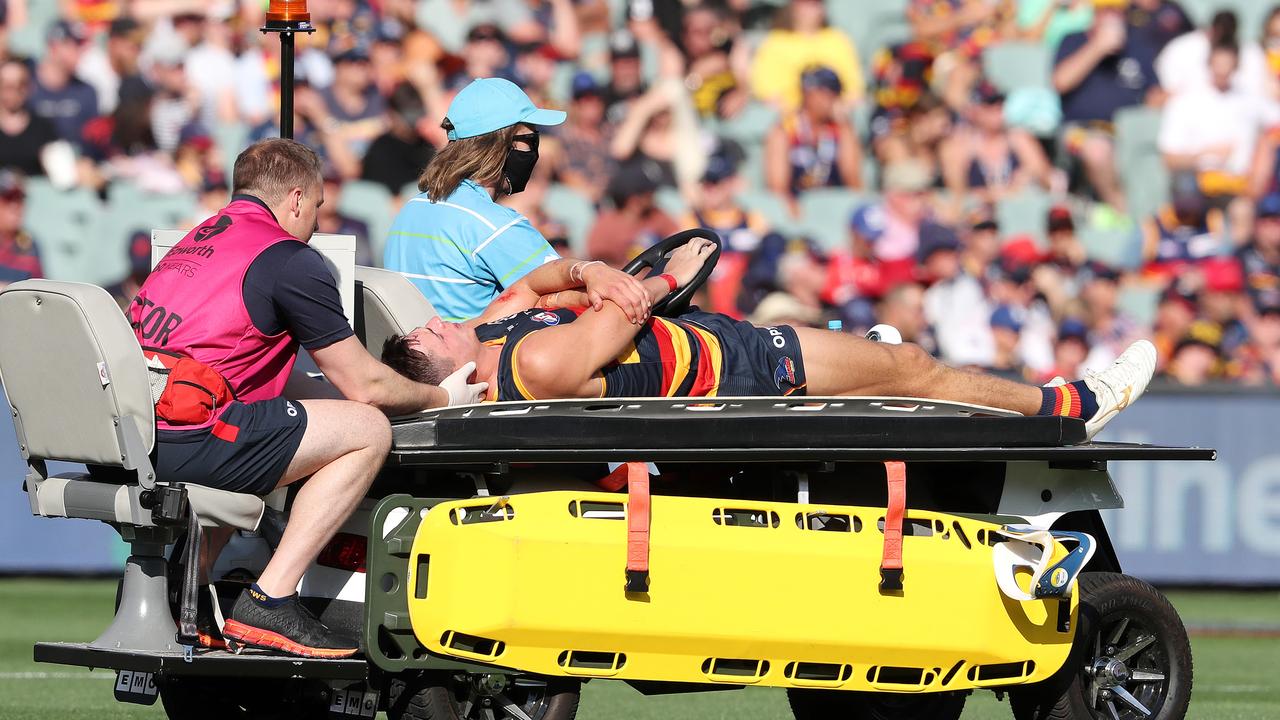 Kelly is taken from the ground after being knocked unconscious in a clash with Patrick Dangerfield. Picture: AFL Photos/Getty Images