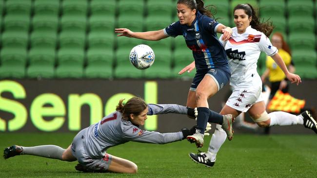 Calder United’s Angela Beard is denied by FC Bulleen Lions keeper Emily Shields while Claudia Fruscalzo watches on. Picture: Hamish Blair