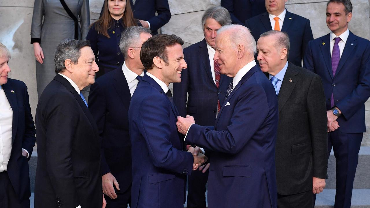 US President Joe Biden shakes hands with France's President Emmanuel Macron (C, L) next to Britain's Prime Minister Boris Johnson (L) and Italy's Prime Minister Mario Draghi (2L) at NATO Headquarters. Picture: JOHN THYS / AFP