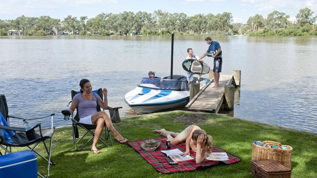 This could be you ... a family enjoys a picnic on the bank of the River Murray in Mannum.