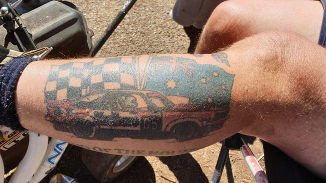 Race fans show off their tattoos at the Bathurst 1000 at Mount Panorama. Picture: Matthew Dunn