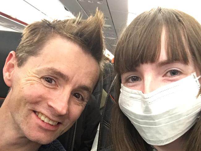 Anthony Burns and his partner Courtney Ward from Frankston in Victoria when they boarded the flight and she put on her face mask. Picture: Supplied