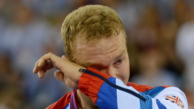 07/08/2012 WIRE: Great Britain's Sir Chris Hoy becomes emotional as he celebrates winning Gold in the Men's Keirin Final on day Eleven of the Olympic Games at the Velodrome in London.. Picture date: Tuesday August 7, 2012. See PA story OLYMPICS Cycling Track. Photo credit should read: John Giles/PA Wire. EDITORIAL USE ONLY OLY12 Pic. Pa