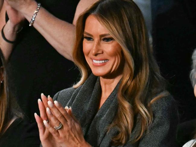 US First Lady Melania Trump (2nd R) stands as she is recognized by US President Donald Trump during Trump's address to a joint session of Congress in the House Chamber of the US Capitol in Washington, DC, on March 4, 2025. (Photo by Jim WATSON / AFP)