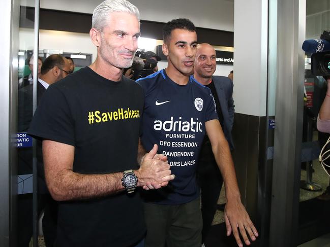 MELBOURNE, AUSTRALIA - FEBRUARY 12: Craig Foster and Hakeem al-Araibi are seen upon al-Araibi's arrival at Melbourne Airport on February 12, 2019 in Melbourne, Australia. Bahraini refugee Hakeem al-Araibi was detained in November when he arrived in Thailand for his honeymoon, spending more than two months in jail while fighting extradition to Bahrain. Al-Araibi fled his home country in 2014 and was granted refugee status in Australia on the grounds he was persecuted and tortured in the Arabian Gulf state for participating in pro-democracy rallies. (Photo by Scott Barbour/Getty Images)