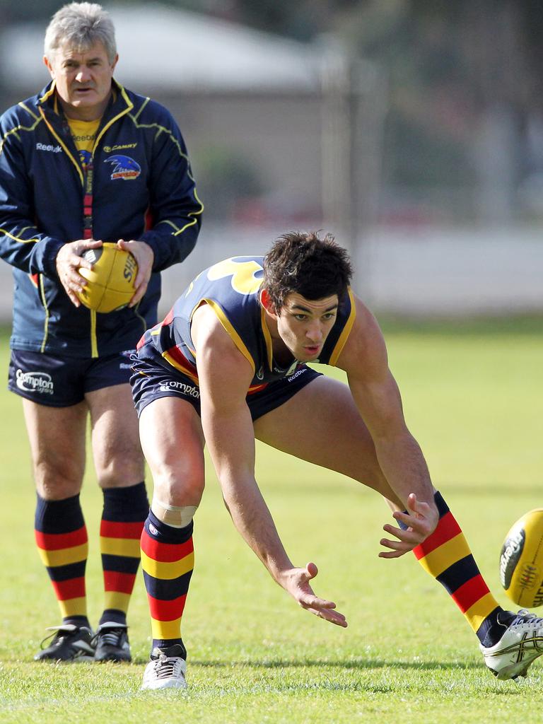 Neil Craig watches a young Taylor Walker at training in 2001.