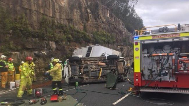 Emergency services on the scene of the crash at Mt White. Pic: Livetraffic.com