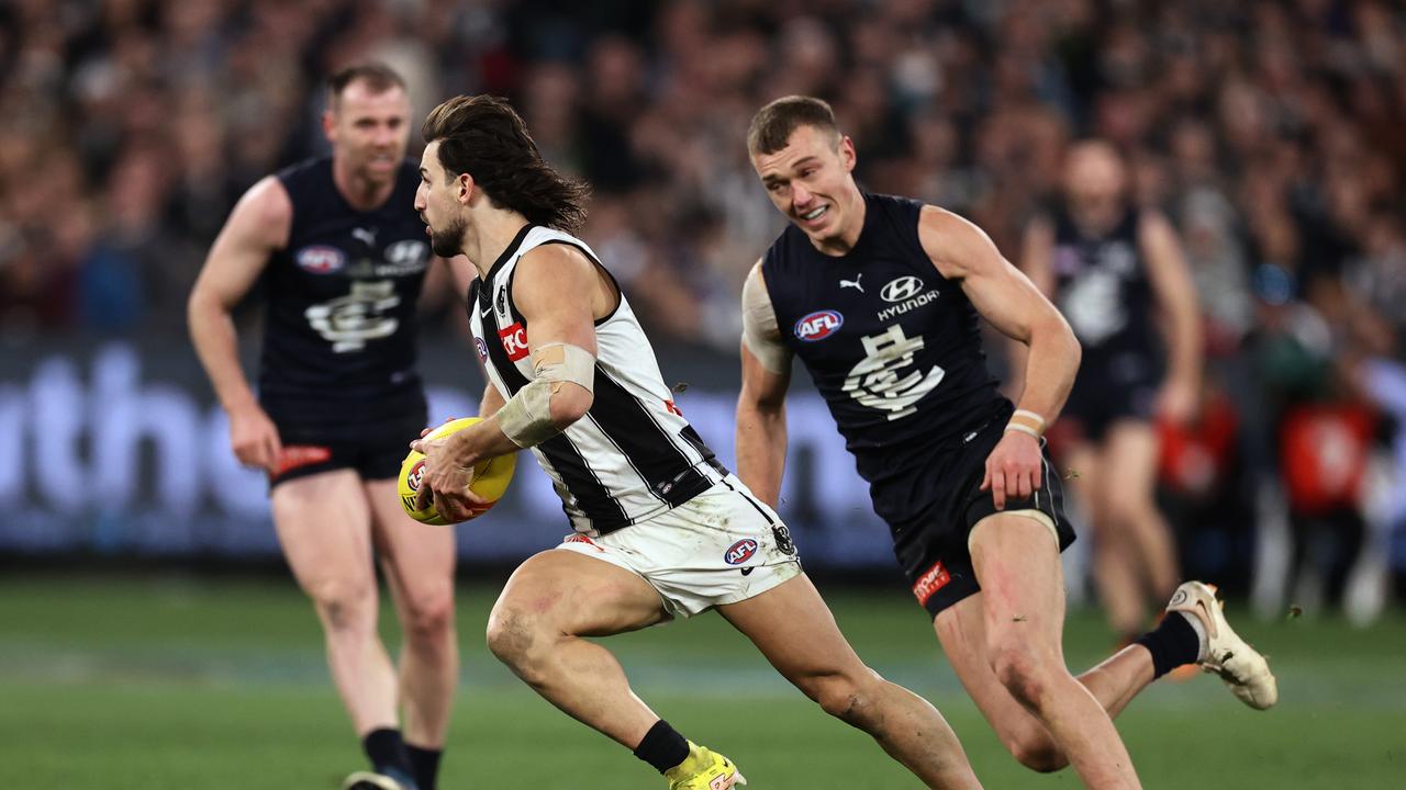 Patrick Cripps chases Josh Daicos. Picture: Michael Klein