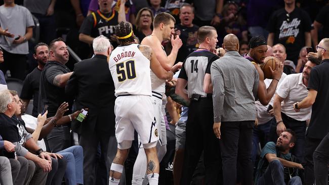 PHOENIX, ARIZONA - MAY 07: Nikola Jokic #15 of the Denver Nuggets has an altercation in the stands during the first half of Game Four of the NBA Western Conference Semifinals at Footprint Center on May 07, 2023 in Phoenix, Arizona. NOTE TO USER: User expressly acknowledges and agrees that, by downloading and or using this photograph, User is consenting to the terms and conditions of the Getty Images License Agreement. (Photo by Christian Petersen/Getty Images)