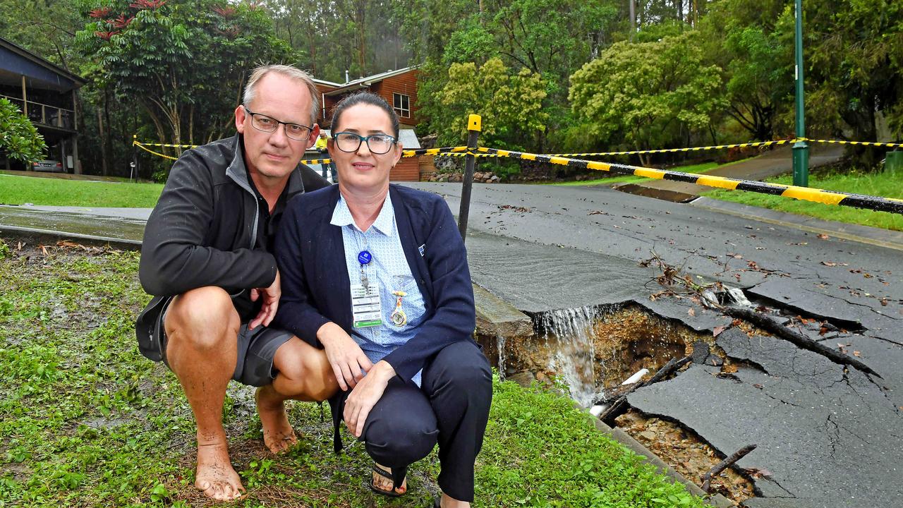 Boxer Ave residents Brian and Nicky Potterton next to the damaged Shailer Park road. Picture: John Gass