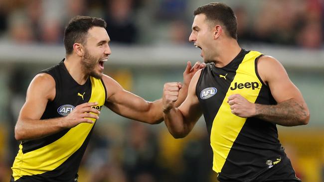 MELBOURNE, AUSTRALIA - APRIL 30: Shane Edwards (left) and Jack Graham of the Tigers celebrate during the 2021 AFL Round 07 match between the Richmond Tigers and the Western Bulldogs at the Melbourne Cricket Ground on April 30, 2021 in Melbourne, Australia. (Photo by Michael Willson/AFL Photos via Getty Images)