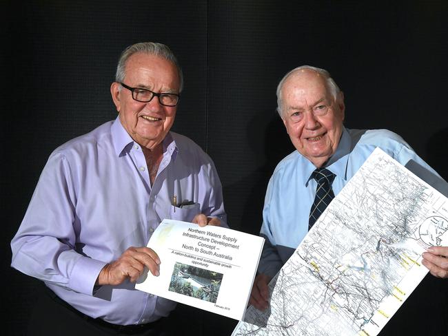 Sir Leo Hielscher and Sir Frank Moore with some of the maps and information about the planned water way from North Queensland to South Australia. Picture: AAP/John Gass