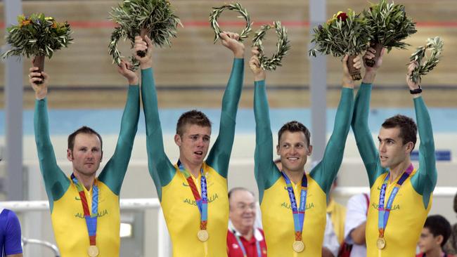 Australian track cyclists Graeme Brown, Brett Lancaster, Luke Roberts and Brad McGee on the podium after being presented with their gold medals in team pursuit final at Athens Olympic Games in 2004. Picture: Craig Borrow