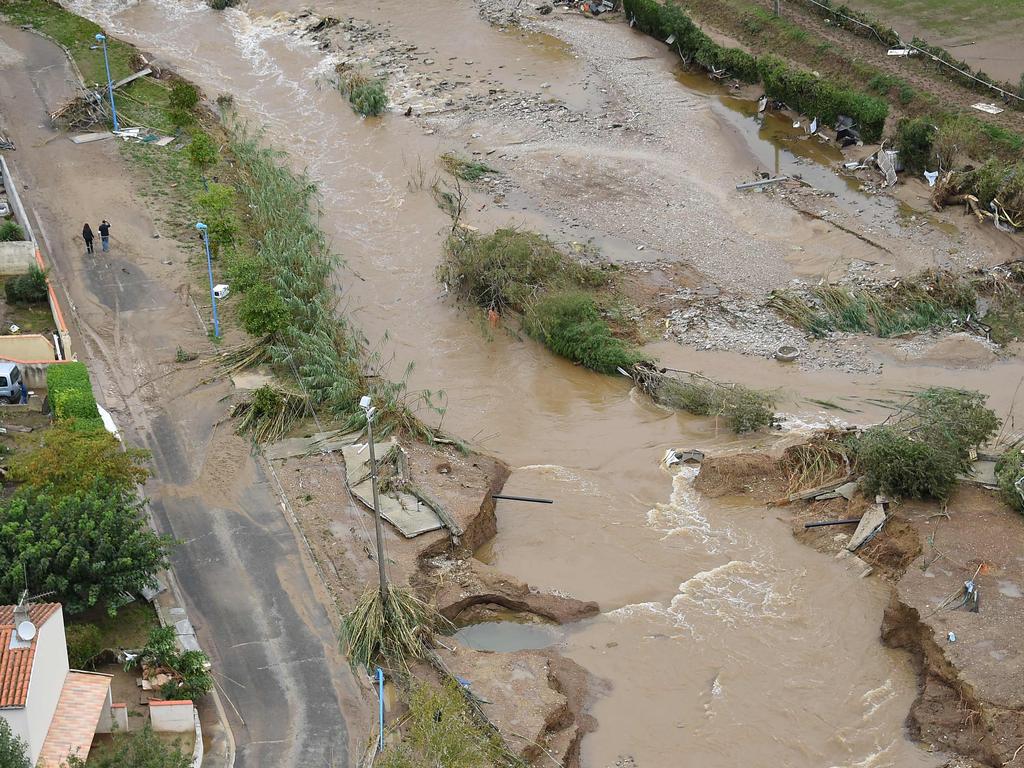 An aerial view shows a flooded road in the city of Villegailhenc, near Carcassonne, southern France. Picture: AFP