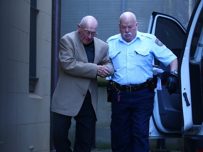 15//06/2016. Roger Rogerson is escorted from King St court in Sydney after being found guilty for the murder of student Jamie Gao. Britta Campion / The Australian.
