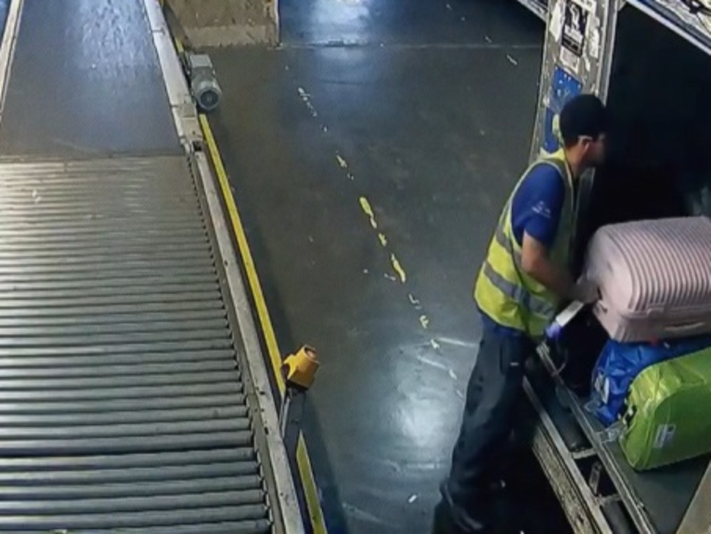 CCTV shows the moment the airport ‘staff’ put the couple’s luggage tags on suitcases full of drugs. Picture: globoplay